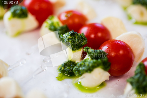 Image of close up of mozzarella and cherry tomato canape