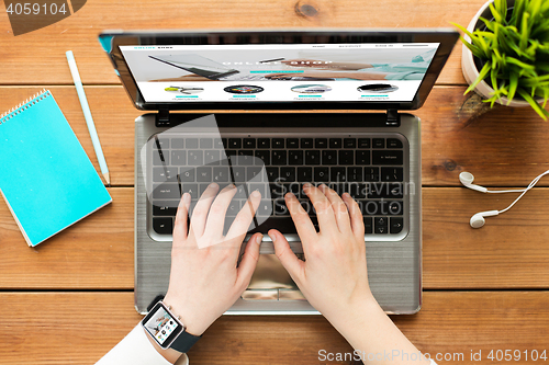 Image of close up of woman with laptop shopping online