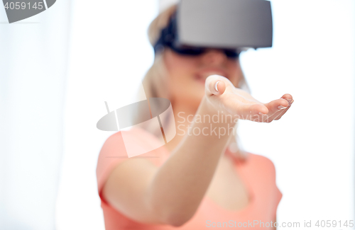 Image of happy woman in virtual reality headset or glasses