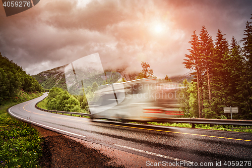 Image of Caravan car travels on the highway.