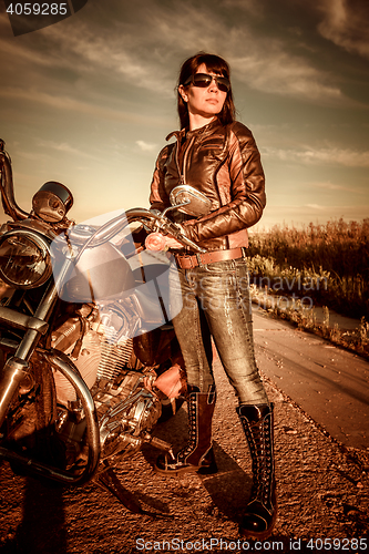 Image of Biker girl and motorcycle