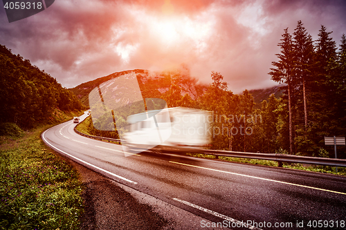 Image of Caravan car travels on the highway.