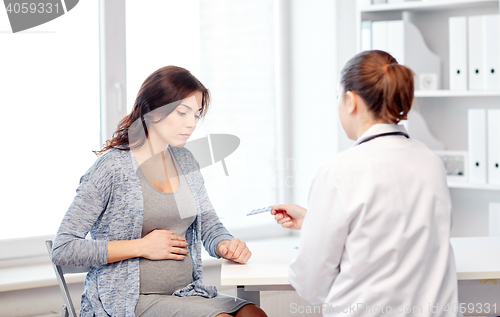 Image of gynecologist doctor and pregnant woman at hospital