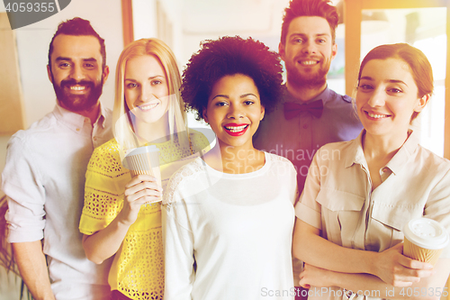 Image of happy creative team in office