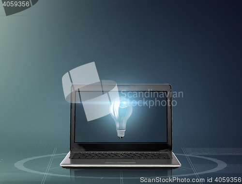 Image of laptop computer with light bulb on screen