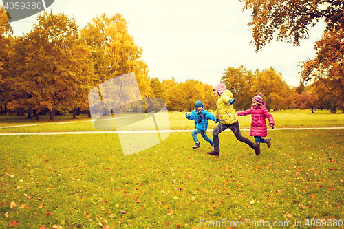 Image of group of happy little kids running outdoors