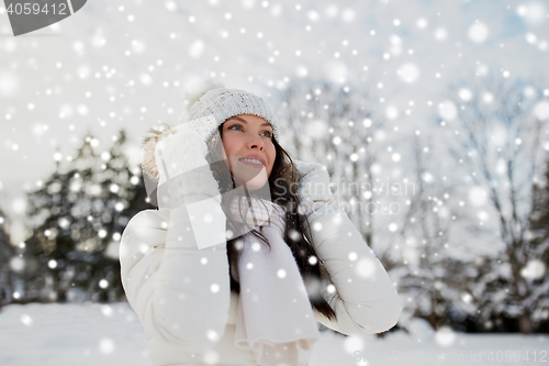 Image of happy woman outdoors in winter