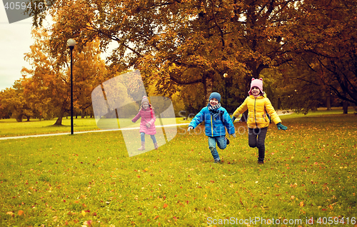 Image of group of happy little kids running outdoors