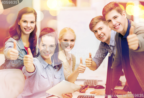 Image of students with computer monitor and tablet pc