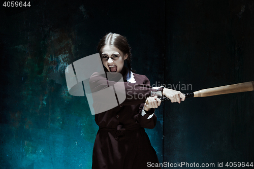 Image of Portrait of a young girl in school uniform as killer woman