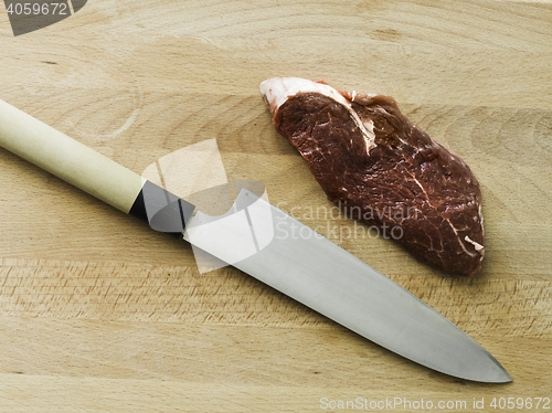 Image of black angus matured steak with a japanese knife