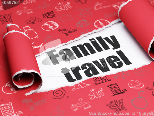 Image of Tourism concept: black text Family Travel under the piece of  torn paper