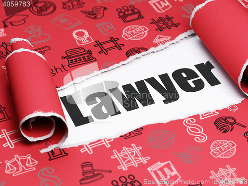 Image of Law concept: black text Lawyer under the piece of  torn paper