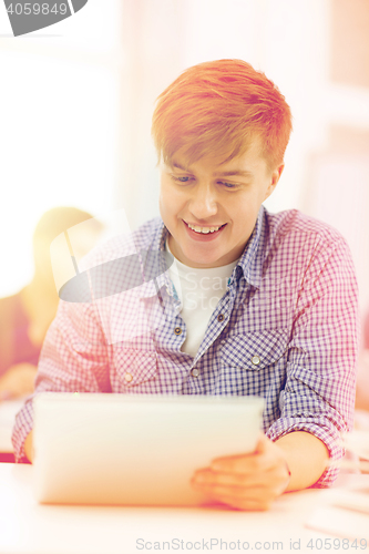 Image of smiling teenage student with tablet pc computer