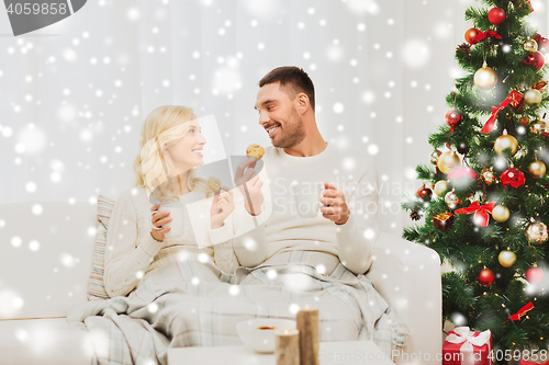 Image of happy couple at home with christmas tree