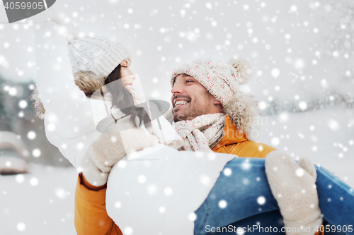 Image of happy couple outdoors in winter