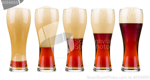 Image of Five glasses of red beer.