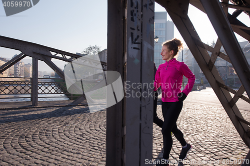 Image of couple warming up before jogging