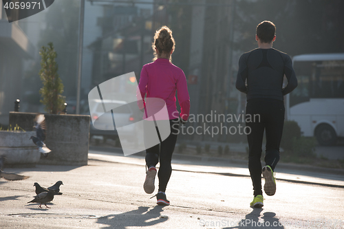Image of young  couple jogging