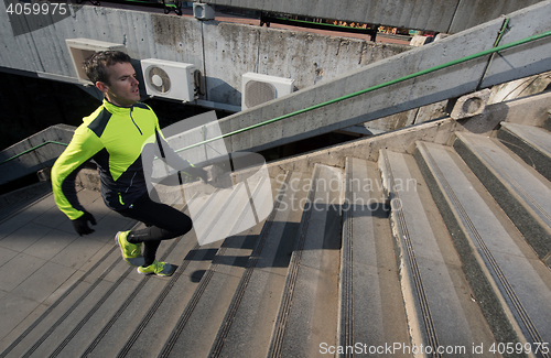 Image of man jogging on steps