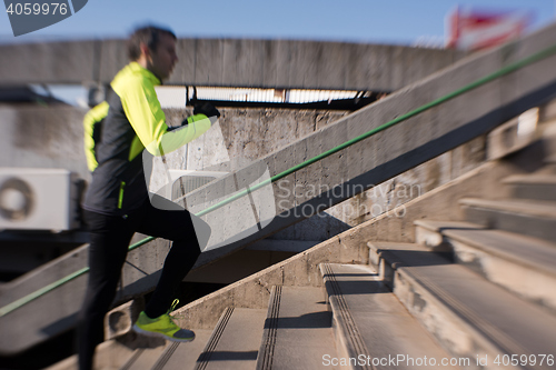 Image of man jogging on steps