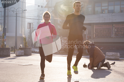 Image of young  couple jogging