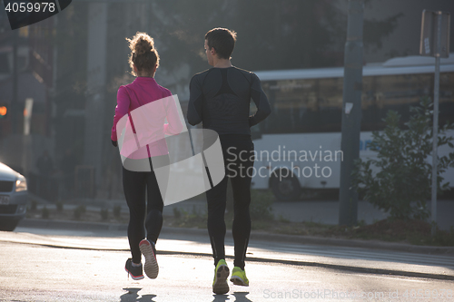 Image of young  couple jogging