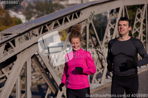 Image of young  couple jogging