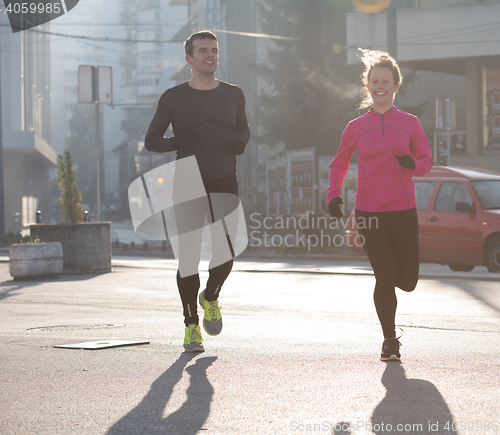 Image of young  couple jogging