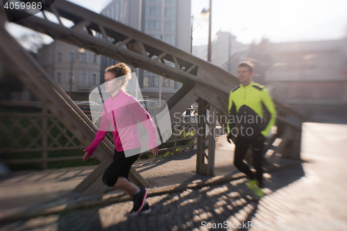 Image of young  couple jogging