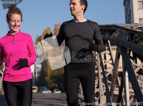 Image of young  couple jogging