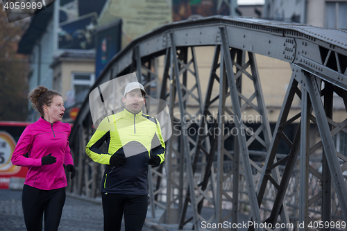 Image of young  couple jogging