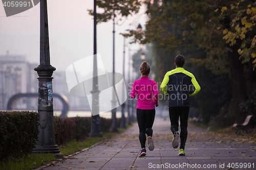 Image of young  couple jogging