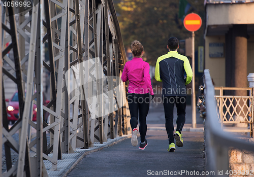 Image of young  couple jogging