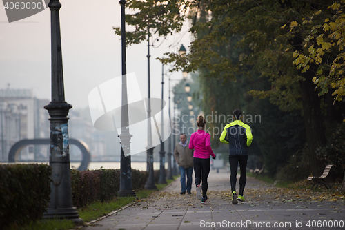 Image of young  couple jogging