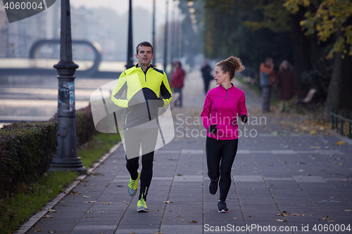 Image of young  couple jogging