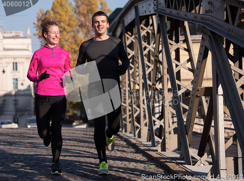 Image of young  couple jogging