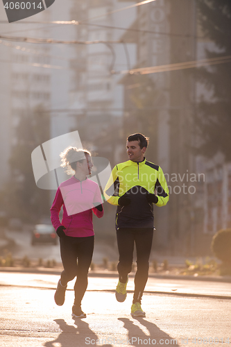 Image of young  couple jogging