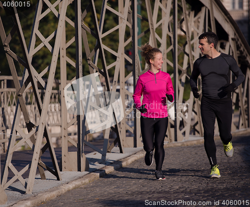 Image of young  couple jogging