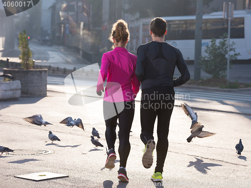 Image of young  couple jogging