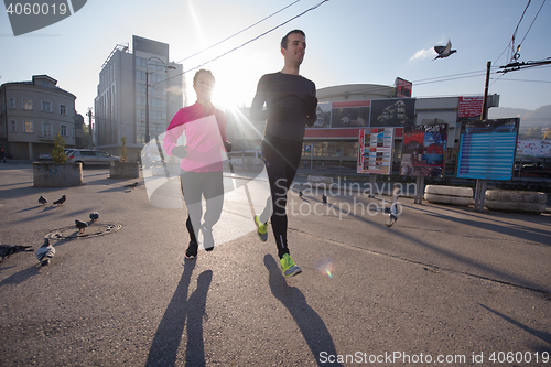 Image of young  couple jogging