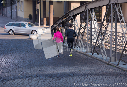 Image of young  couple jogging