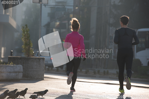 Image of young  couple jogging