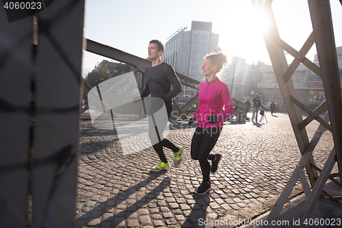 Image of young  couple jogging