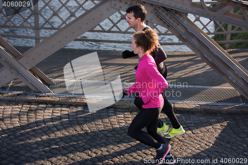 Image of young  couple jogging