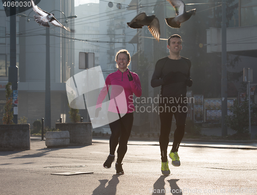 Image of young  couple jogging