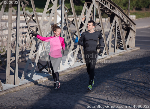 Image of young  couple jogging