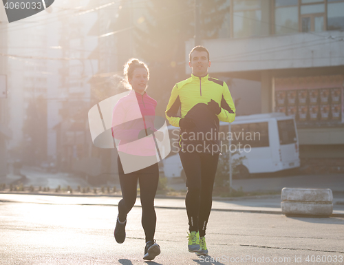 Image of young  couple jogging