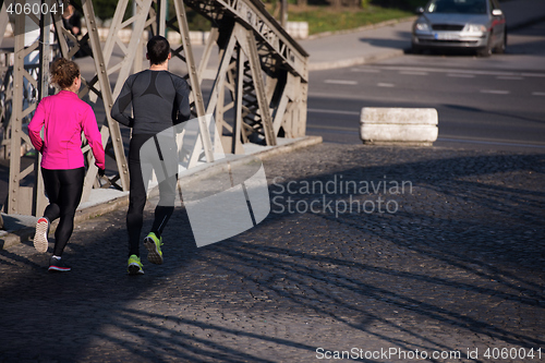 Image of young  couple jogging