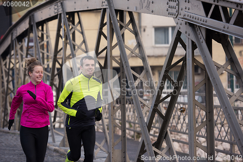 Image of young  couple jogging